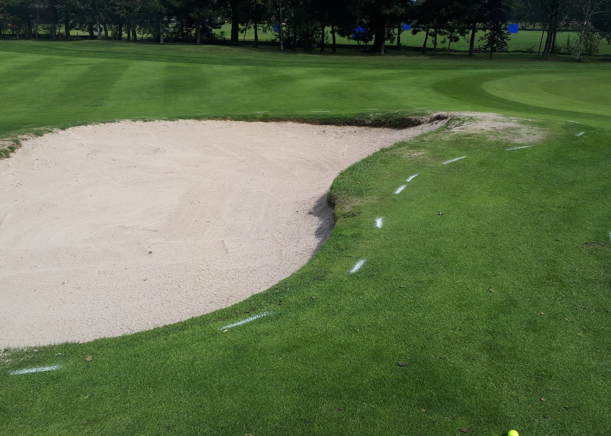 White lines around apron bunkers